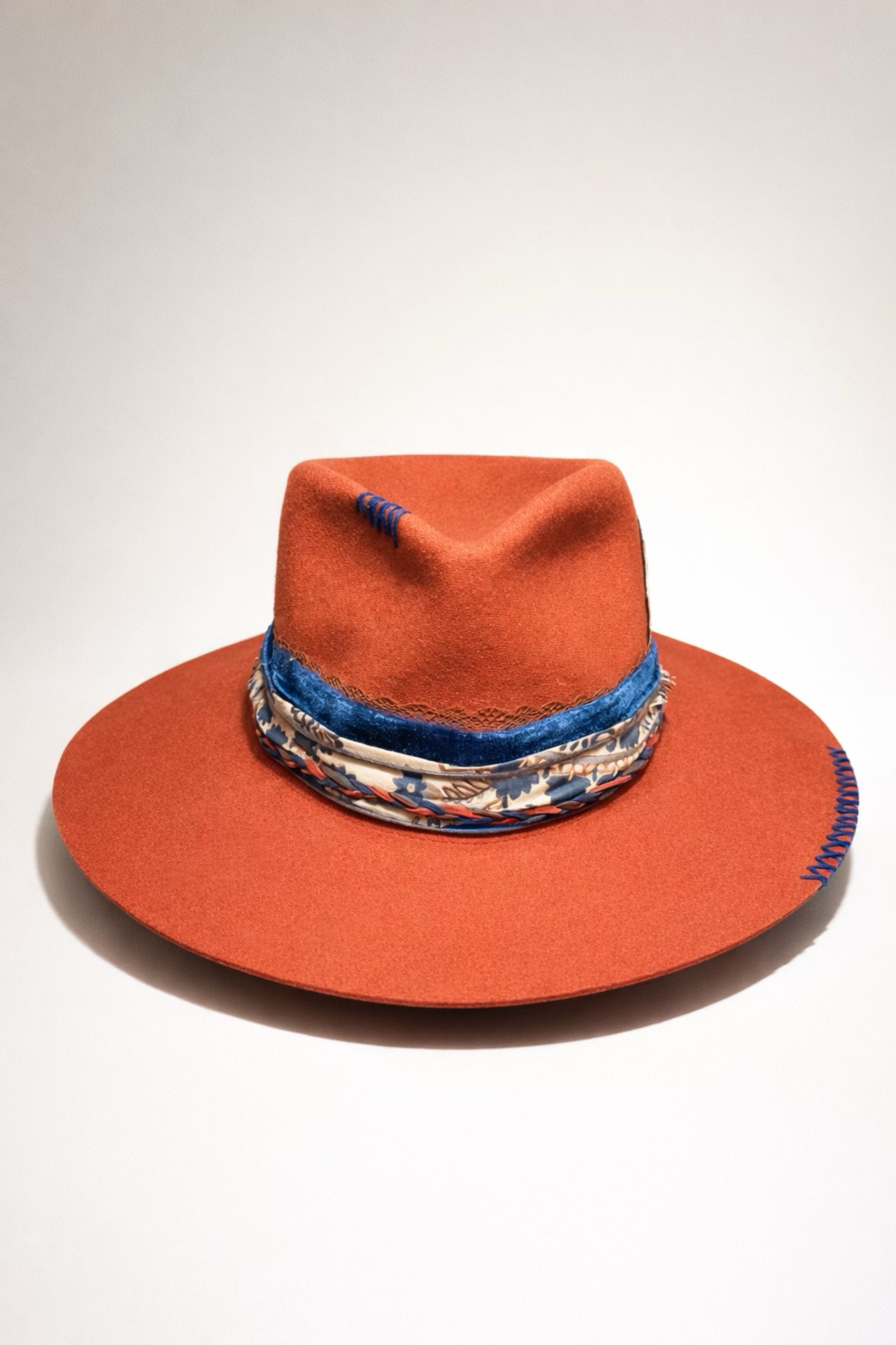 burnt orange fedora hat UK blue detail western style
	•	custom western hat UK orange fedora with stitching